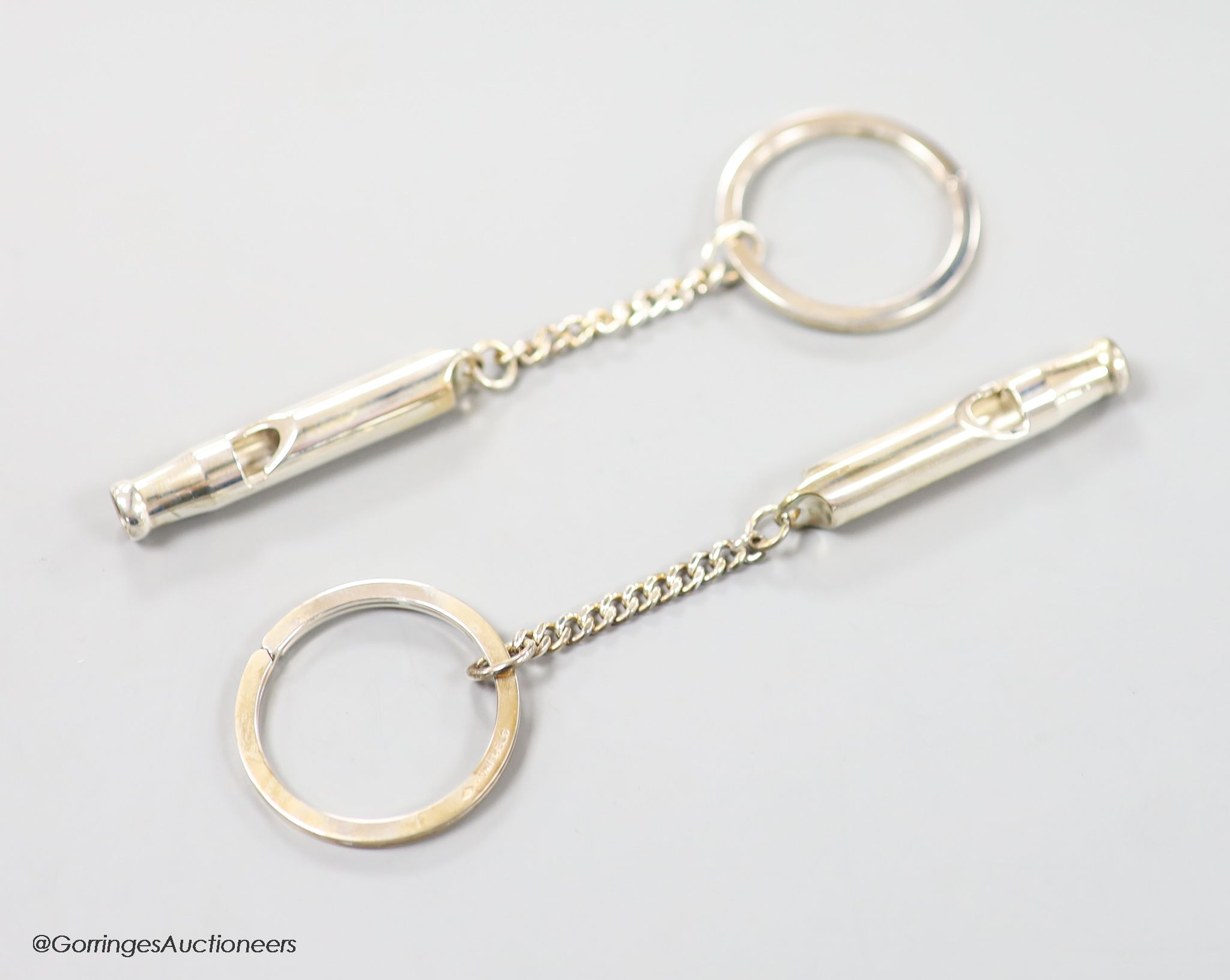 Two boxed modern silver Master of Craftmanship sterling 915 whistle key chains.
